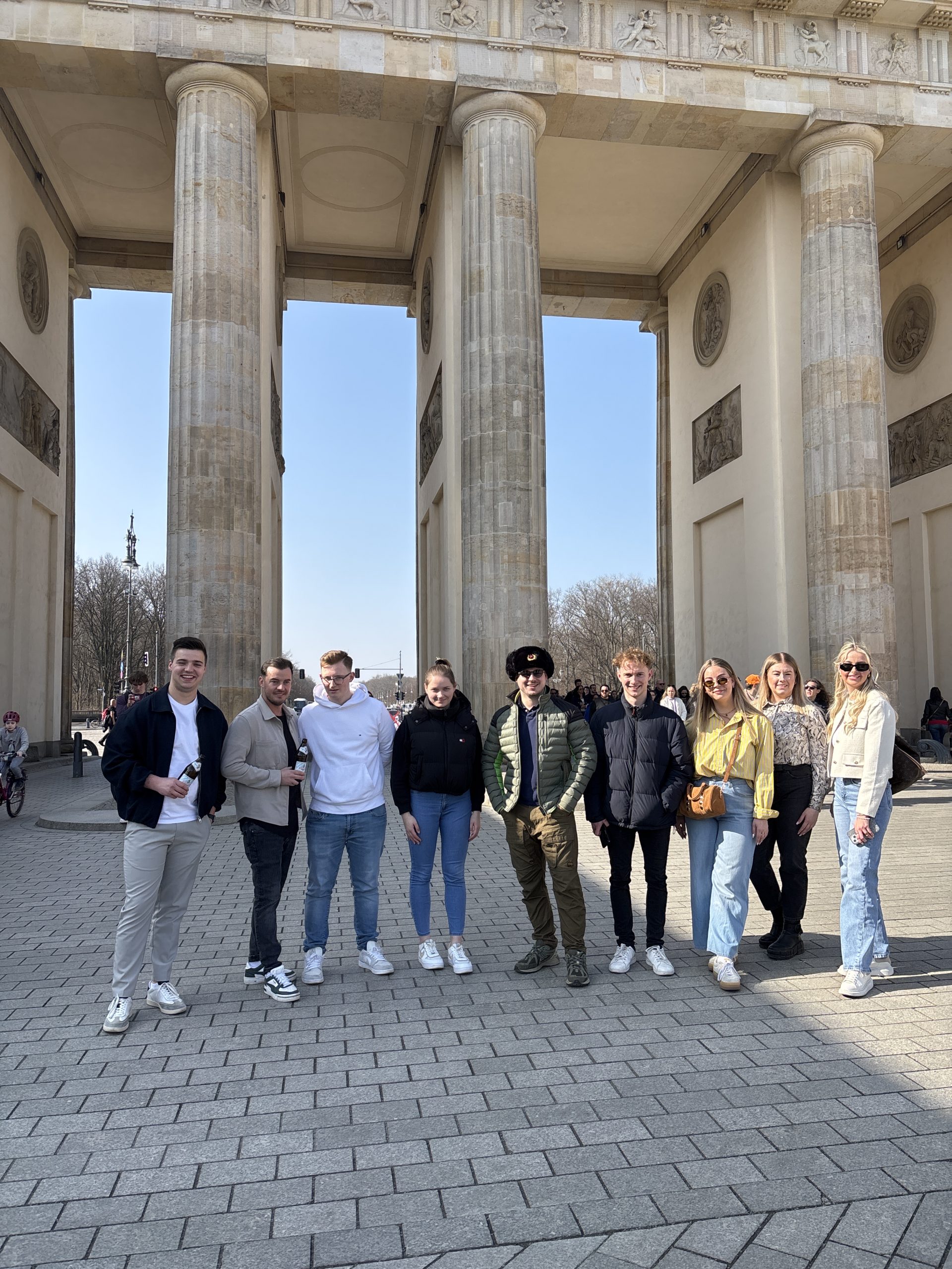 Corporate event in Berlin with team activity: colleagues exploring the city on an app-guided rally, ending with a shared dinner.